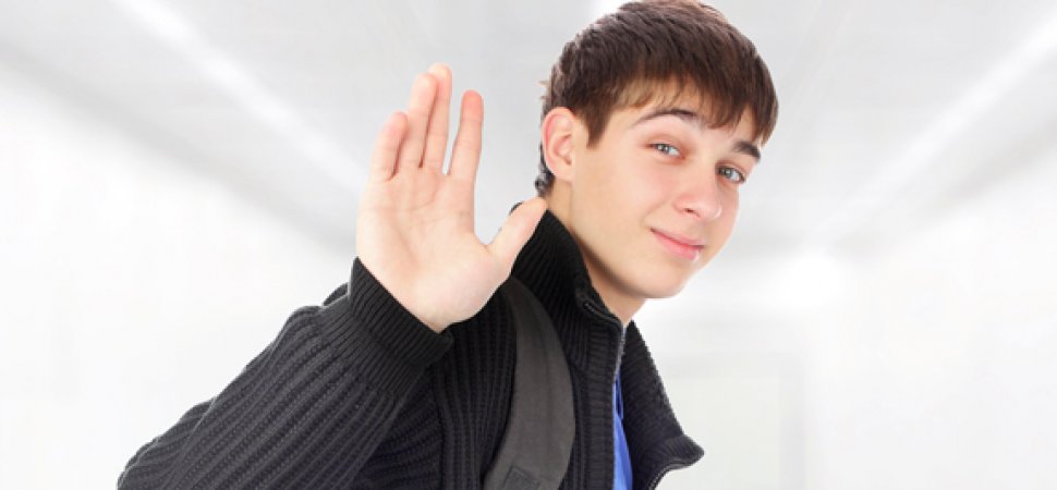 Young man waving goodbye