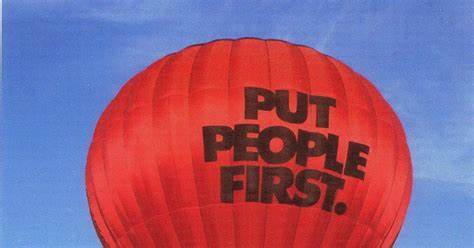 hot air balloon with words' put people first' on